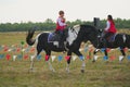 Girls on a horse in a traditional Cossack costume