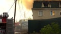 Samara, Russia - July 30, 2019: Russian firefighters extinguish a fire a three-story house. The big fire of a