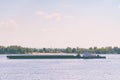 A loaded barge sails along the Volga River