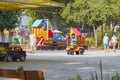 Little boys ride on childrens cars in the park