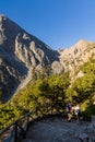 SAMARIA GORGE, CRETE - 20 JULY 2021: Hikers in the spectacular mountain and forest scenery of the Samaria Gorge on the Greek Royalty Free Stock Photo