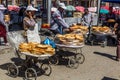 SAMARKAND, UZBEKISTAN: APRIL 27, 2018: Local bread sellers at the Siyob Siab Bazaar in Samarkand, Uzbekist Royalty Free Stock Photo