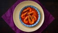 `Sambal Udang` or Spicy Chili prawns in a blue and wooden plate over wooden background. South East Asian cuisine. Royalty Free Stock Photo