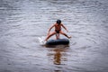 SAMBAS, INDONESIA - SEPTEMBER 18: Unidentified children at Sambas Lake, swimming at the lake on September 18, 2018 in Sambas, Indo