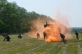 Russian special forces soldiers will regroup on the battlefield using a orange smoke screen Royalty Free Stock Photo