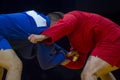 Sambo fighter attacking his opponent with leg technique Royalty Free Stock Photo