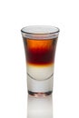 Sambuca and Jagermeister cocktail in shot glass isolated on white Royalty Free Stock Photo