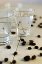 Sambuca in shot glasses and coffee beans Royalty Free Stock Photo