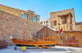 The sambuk fishing boat in front of arish traditional house, Al Fahidi Fort, Dubai, UAE Royalty Free Stock Photo