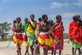 Maasai people are dancing and celebrating outdoors in the samburian wilderness