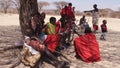 Samburu tribesmen resting against a tree.