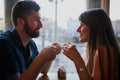 This is the same coffee shop where they first met. an affectionate young couple sitting in a coffee shop while on a date Royalty Free Stock Photo