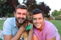 Same sex couple with a gorgeous pet outdoors Royalty Free Stock Photo
