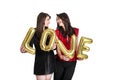 Same sex love concept. Two beautiful females women girls from lgbt community with long gorgeous hair on February 14th Happy valent Royalty Free Stock Photo