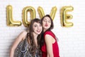 Same sex love concept. Two beautiful females women girls from lgbt community with long gorgeous hair on February 14th Happy valent Royalty Free Stock Photo