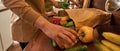 Same-sex male pair hands washing vegetables