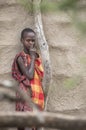 Masai boy by his home