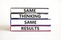 Same thinking and results symbol. Concept word Same thinking same results on books. Beautiful white table white background. Royalty Free Stock Photo