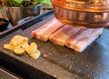 Samgyeopsal - Traditional Korean pork belly barbecue grilled with vegetable and garlic Royalty Free Stock Photo