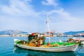 SAMI PORT, KEFALONIA ISLAND, GREECE - SEP 20, 2014: traditional Greek fishing boat in port of Sami village. Colourful boats are Royalty Free Stock Photo