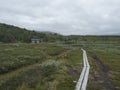 Sami village Staloluokta at Virihaure lake with houses and cottage, mountains and birch trees. summer moody and foggy Royalty Free Stock Photo