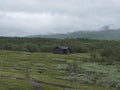 Sami village Staloluokta at Virihaure lake with houses and cottage, mountains and birch trees. summer moody and foggy Royalty Free Stock Photo