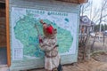 Sami woman is studying a map of Russian Lapland. located in saami village Lovozero on the Kola Peninsula, Russia Royalty Free Stock Photo