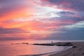 The Samila beach in Songkhla Province at sunrise with fisherman in a distant