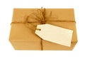 Samm paper parcel tied with string, blank manila message label, isolated on white Royalty Free Stock Photo