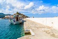 Traditional Greek fishing boat anchoring in Kokkari port, Samos island, Greece Royalty Free Stock Photo