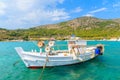 White traditional fishing boat on sea water in Posidonio bay, Samos island, Greece Royalty Free Stock Photo