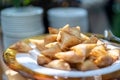 A samosa is a fried or baked pastry with a savoury filling, such as spiced potatoes, onions, peas, meat, or lentils. It may take Royalty Free Stock Photo