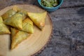 Samosa fried hot, delicious is placed on a plate of wood. Royalty Free Stock Photo