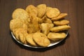 Samosa and matthi mathari/kachori Indian dish made of fine wheat flour stuffed with potato mesh served in glass dish with wooden