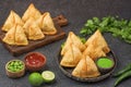Samosa or samboosa with sauce and black background Royalty Free Stock Photo