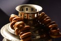 Samovar detail vintage russian metal on dark background with bagels