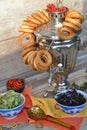 Samovar. Russian tradition of tea drinking. Bagels Russian sweets for tea. Vertical photo