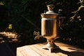 samovar on a table in the garden.