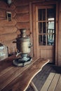 The samovar is on the table. Interior of a peasant izba. Closeup. Retro. Selective focus Royalty Free Stock Photo