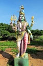 Sample of ancient Indian sculpture - a statue of the god Shiva Ardhanarishvara near the old temple Parameswara