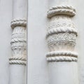 a sample of decorative stucco on an old building, an element of architecture