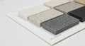 A sample display sheet features eight rectangular stone-like material samples, Royalty Free Stock Photo