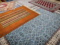 a sample of five handmade wool and silk carpets, typical turkish handmade kilim carpets and rugs in a Turkish carpet store Royalty Free Stock Photo