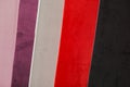 Sample - a good quality velvet in various colors. black, red, white pieces of velvet. Corduroy for furniture upholstery Royalty Free Stock Photo