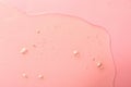 Sample of hydrophilic oil on pink background, top view