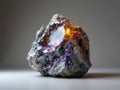 Close-Up of a Rough Rock Formation with Glowing Amethyst Crystals Royalty Free Stock Photo
