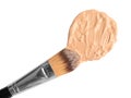 Sample of liquid foundation and makeup brush on white background Royalty Free Stock Photo