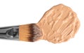 Sample of liquid foundation and makeup brush on white background Royalty Free Stock Photo