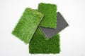 Sample pieces of green artificial grass of different thickness Royalty Free Stock Photo
