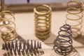 Sample product of blue and yellow metal helical coil springs.
